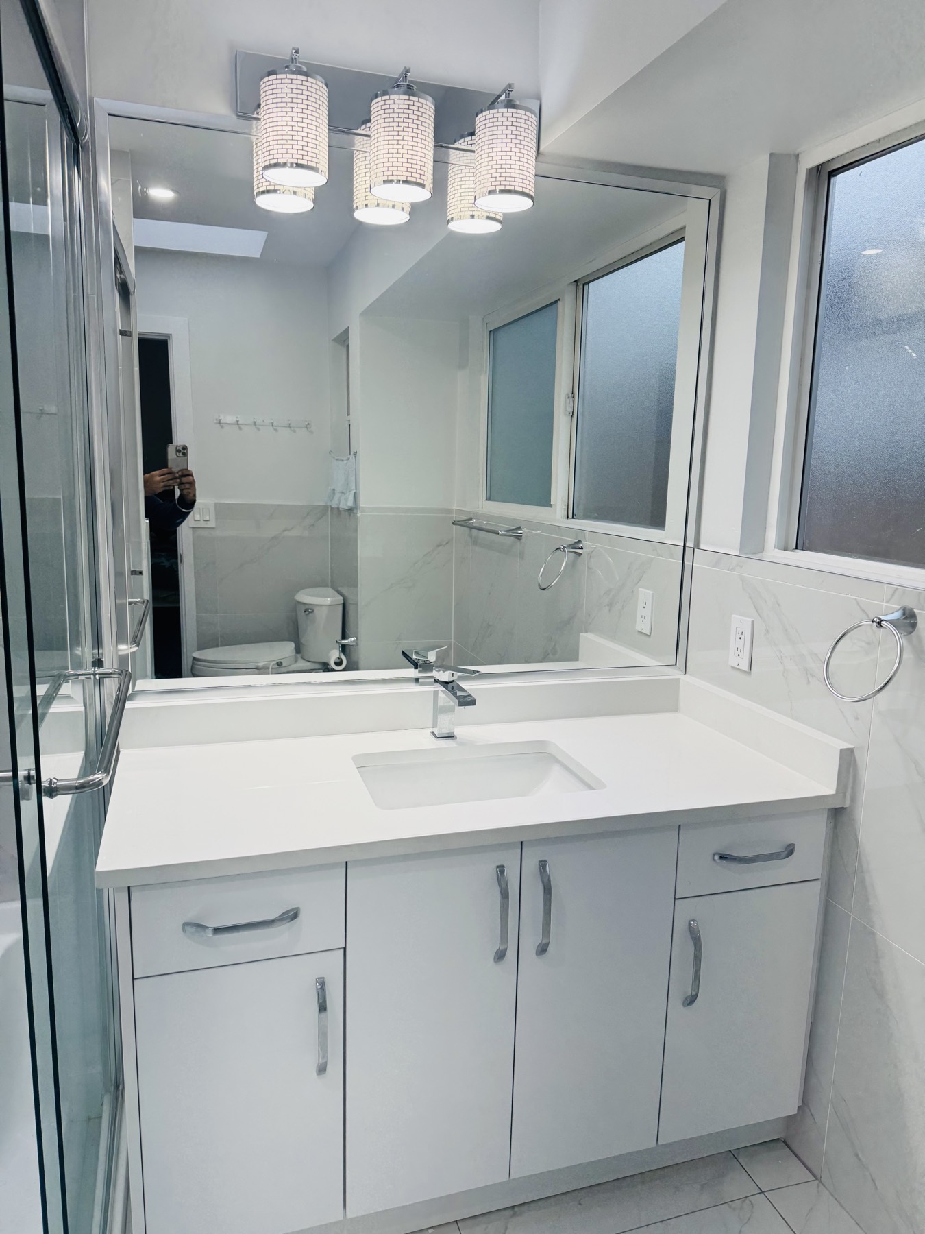 Washroom with double vanity and walk in shower