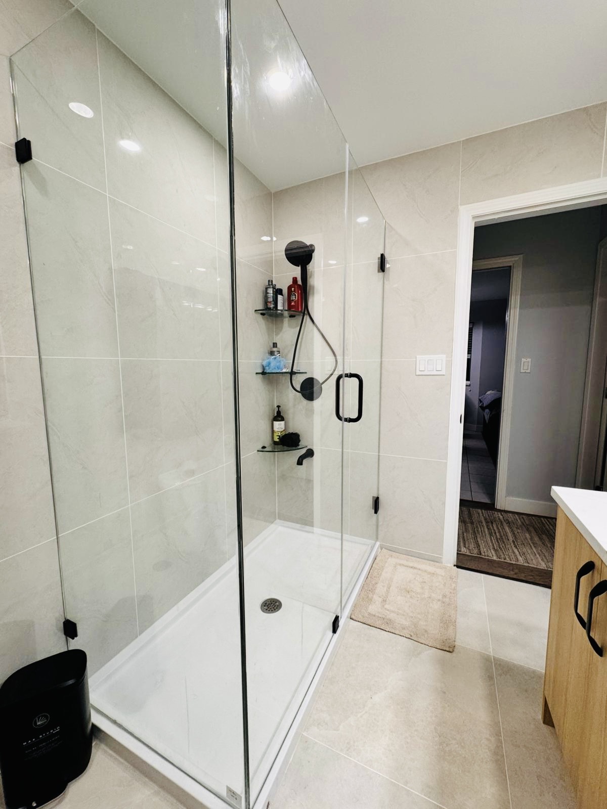 Shower enclosure with timber vanity alongside